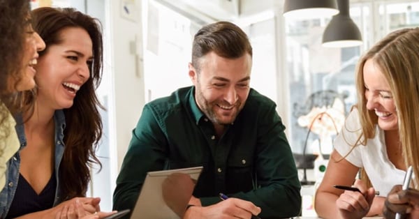 Employees laughing in an office